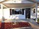Front view of a charming house with a covered porch at 11179 Sw 78Th Ct, Ocala, FL 34476