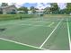 Outdoor pickleball and tennis court with green surface at 11179 Sw 78Th Ct, Ocala, FL 34476