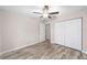 Bedroom with double door closet and wood flooring at 11350 Sw 62Nd Cir, Ocala, FL 34476