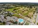Aerial view of community with golf course and clubhouse at 13195 Se 93Rd Cir, Summerfield, FL 34491