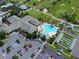 Community clubhouse and pool with surrounding parking at 13195 Se 93Rd Cir, Summerfield, FL 34491
