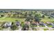 Aerial community view, showing homes near a lush green golf course at 13195 Se 93Rd Cir, Summerfield, FL 34491