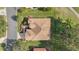 Aerial view of single-Gathering home with tile roof, driveway, and landscaped yard at 13195 Se 93Rd Cir, Summerfield, FL 34491