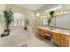 Spa-like bathroom featuring a large soaking tub, double vanity, and shower at 13195 Se 93Rd Cir, Summerfield, FL 34491