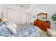 Bright bedroom with a comfortable queen bed and ample closet space at 13195 Se 93Rd Cir, Summerfield, FL 34491