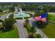 Entrance to community with fountain and flag at 13195 Se 93Rd Cir, Summerfield, FL 34491