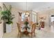 Bright dining room features a glass-top table and four chairs at 13195 Se 93Rd Cir, Summerfield, FL 34491