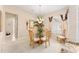 Charming dining room with a glass-top table and four chairs at 13195 Se 93Rd Cir, Summerfield, FL 34491