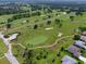 Aerial view of a lush green golf course at 13195 Se 93Rd Cir, Summerfield, FL 34491