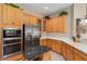 Kitchen features stainless steel appliances and ample wood cabinetry at 13195 Se 93Rd Cir, Summerfield, FL 34491