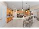 Well-equipped kitchen with light wood cabinets and stainless steel appliances at 13195 Se 93Rd Cir, Summerfield, FL 34491