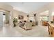 Spacious living room with comfortable seating and large windows at 13195 Se 93Rd Cir, Summerfield, FL 34491