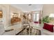Elegant living room with hardwood floors and two armchairs at 13195 Se 93Rd Cir, Summerfield, FL 34491