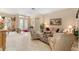 Spacious living room with comfortable seating and large windows at 13195 Se 93Rd Cir, Summerfield, FL 34491