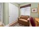 Bright home office with built-in shelves and seating area at 13195 Se 93Rd Cir, Summerfield, FL 34491