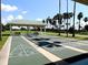 Outdoor shuffleboard courts with covered seating area at 13195 Se 93Rd Cir, Summerfield, FL 34491