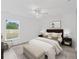 Spacious bedroom featuring a bed, window, and light flooring at 16691 Sw 30Th Terrace Rd, Ocala, FL 34473
