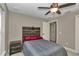 Cozy bedroom featuring a rustic bed frame and ceiling fan at 171 Oak Circle, Ocala, FL 34472