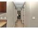 Bright hallway with carpet flooring and doors to bedrooms at 171 Oak Circle, Ocala, FL 34472