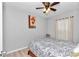 Cozy bedroom featuring a ceiling fan and window curtains at 1995 Sw 160Th Pl, Ocala, FL 34473