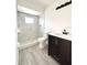 Clean bathroom with a large shower, updated vanity and toilet at 21111 Sw Honeysuckle St, Dunnellon, FL 34431