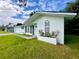White single story house with updated landscaping at 21111 Sw Honeysuckle St, Dunnellon, FL 34431