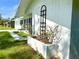 Side view of the house, showing a garden planter at 21111 Sw Honeysuckle St, Dunnellon, FL 34431