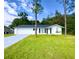 Newly renovated single story home with a large grassy yard at 21111 Sw Honeysuckle St, Dunnellon, FL 34431