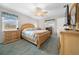 Spacious bedroom with wood furniture and a ceiling fan at 2201 Nw 135Th Ln, Citra, FL 32113