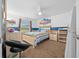 Cozy bedroom with light wood furniture and blue accents at 2201 Nw 135Th Ln, Citra, FL 32113