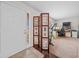 Inviting entry with a room divider and view into home office at 2201 Nw 135Th Ln, Citra, FL 32113