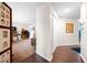 Bright entryway with wood-look floors and view into living area at 2201 Nw 135Th Ln, Citra, FL 32113