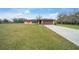 Ranch house on a large lot with a long driveway at 2201 Nw 135Th Ln, Citra, FL 32113