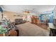 Spacious living room with leather furniture and hardwood floors at 2201 Nw 135Th Ln, Citra, FL 32113