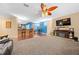 Open living room with a fireplace and hardwood floors at 2201 Nw 135Th Ln, Citra, FL 32113