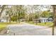 Farm with multiple buildings, large yard, and a gravel driveway at 2751 Ne 46Th St, Ocala, FL 34479