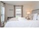 Relaxing bedroom with a white bed and large windows at 2751 Ne 46Th St, Ocala, FL 34479