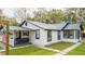 Renovated home with a gray swing and a metal roof at 2751 Ne 46Th St, Ocala, FL 34479