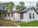 White sided home with black trim and a metal roof at 2751 Ne 46Th St, Ocala, FL 34479