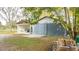 Two-car garage with covered carport and large doors at 2751 Ne 46Th St, Ocala, FL 34479