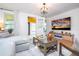 Open living space featuring a large TV, comfy seating, and access to a porch at 2751 Ne 46Th St, Ocala, FL 34479
