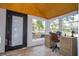 Bright sunroom with desk and view at 2751 Ne 46Th St, Ocala, FL 34479