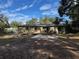 Charming backyard with patio, firepit, and deck at 3640 Se 131St Ln, Belleview, FL 34420