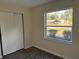 Spacious bedroom with a large window and ample closet space at 3640 Se 131St Ln, Belleview, FL 34420