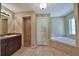 Elegant bathroom with double vanity, soaking tub, and shower at 5230 Nw 56Th Ter, Ocala, FL 34482