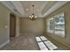Bright dining room with tile floors and chandelier at 5230 Nw 56Th Ter, Ocala, FL 34482