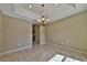 Bright dining room with tile floors and chandelier at 5230 Nw 56Th Ter, Ocala, FL 34482