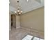 Bright dining room with tile floors and chandelier at 5230 Nw 56Th Ter, Ocala, FL 34482