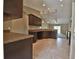 Open concept kitchen with ample counter space and dark wood cabinets at 5230 Nw 56Th Ter, Ocala, FL 34482