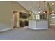 Open kitchen with dark wood cabinets and breakfast bar at 5230 Nw 56Th Ter, Ocala, FL 34482